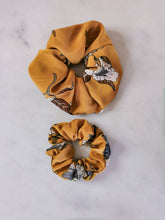Load image into Gallery viewer, jumbo and regular sized mustard colored scrunchies with floral print